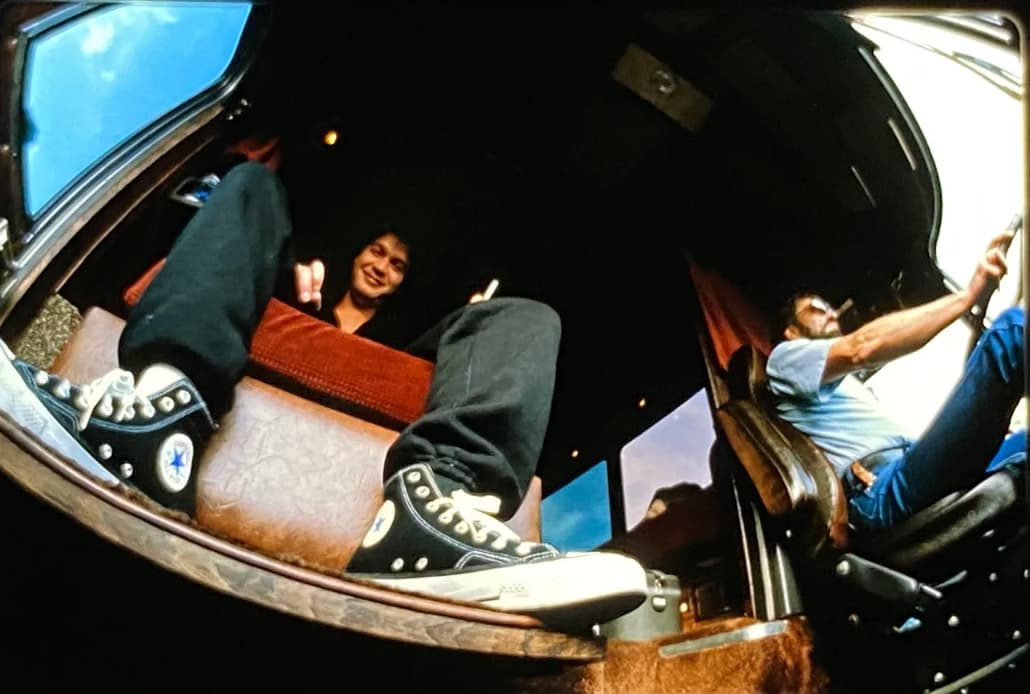 Eddie Van Halen smiles from his band’s tour bus jump seat, date unknown. 